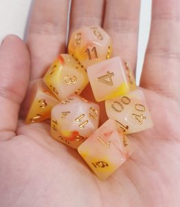 Caleb red yellow opal effect dungeons and dragons polyhedral dice set