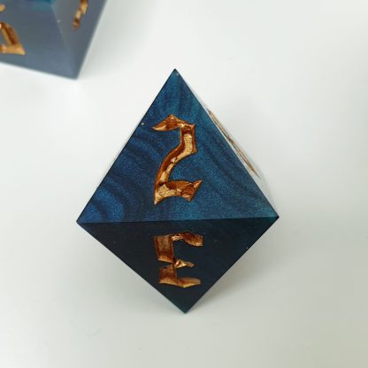 Blue back and teal dirty pour sharp edge handmade polyhedral dungeons and dragons dice set